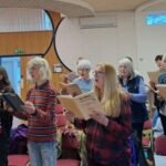 a few singers standing Quinborne Choir South West Birmingham
