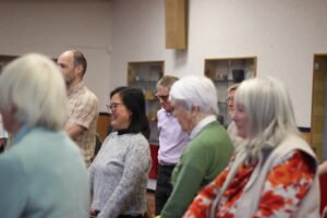Mixed adult classical choir warm up at rehearsing, Birmingham