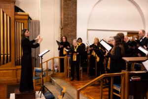 side view of some of Quinborne choir sopranos singing in choral concert Quinborne Choir, Birmingham, UK